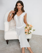 White pleated lace side-slit mesh dress with deep V-neck and layered mid-calf skirt
