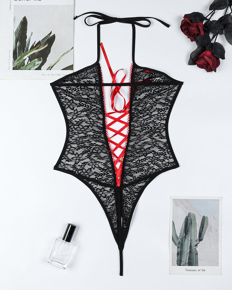 Black lace crotchless bodysuit with red lace-up front and neck tie straps