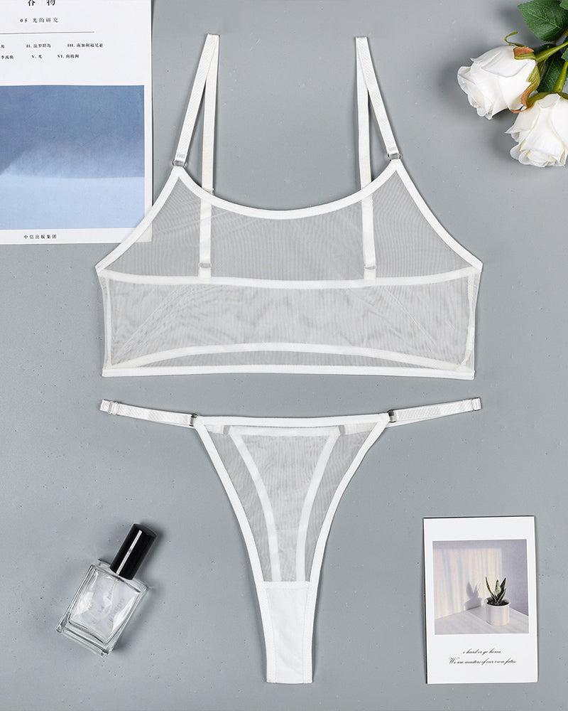 White mesh see-through camisole bra and thong set, laid flat