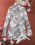 Black-and-white printed mesh mini dress, mock neck and long sleeves, tied back hem