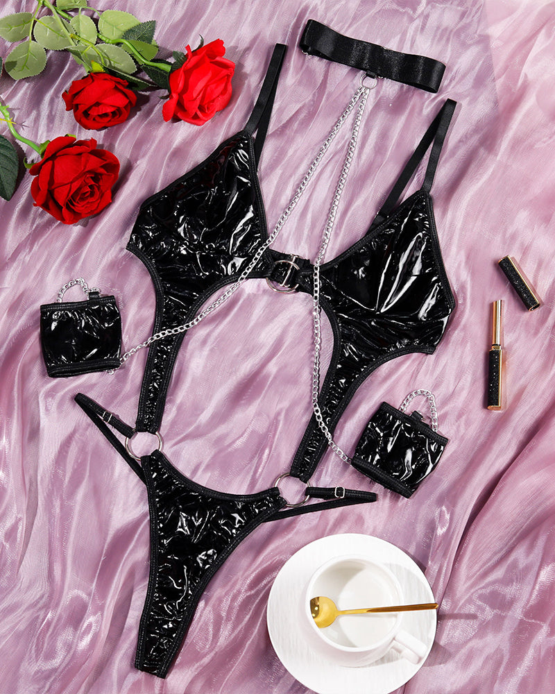 Black PU lingerie set with choker, bra and thong, silver chain straps and matching cuffs