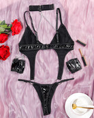 Black PU lingerie set with choker, bra and thong, silver chain straps and wrist cuffs