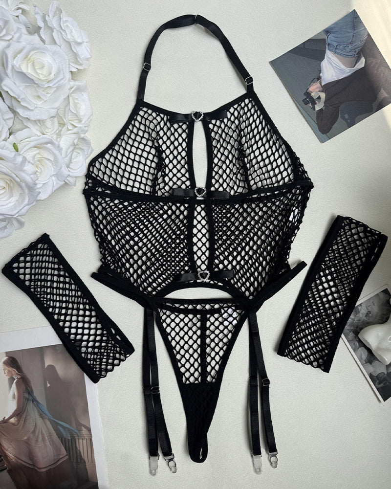 Black fishnet lingerie pieces: open bra, thong, garters, and two thigh-highs