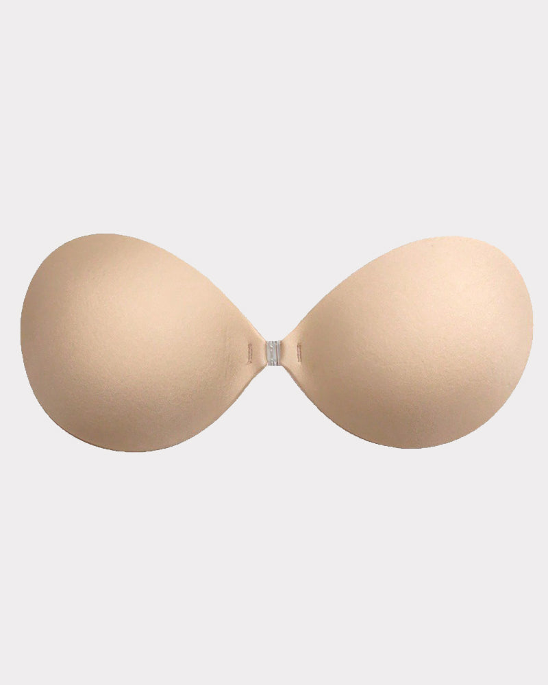 Beige stick-on push-up bra cups with center clasp, smooth molded shape