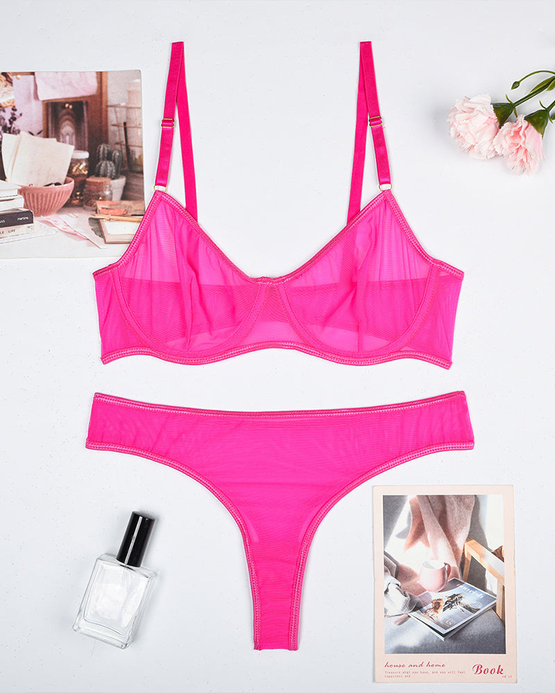 Pink sheer mesh underwire bra and thong panty set, flat lay
