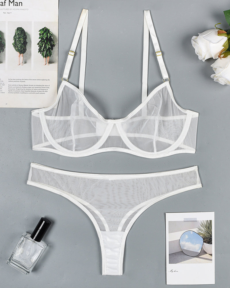 White sheer mesh underwire bra and thong panty set, flat lay