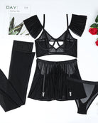 Black lingerie set flat lay: heart cutout bra, tulle skirt, garter stockings, panty