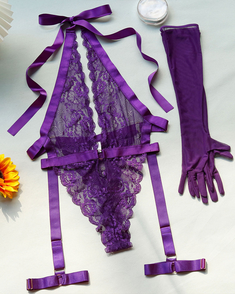 Purple lace halter bodysuit with garters and long gloves laid flat