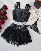 Flat lay black lingerie set with corset top and ruffled mini skirt