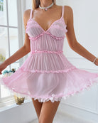 Pink ruffled babydoll mini dress with tiered skirt and scalloped hem
