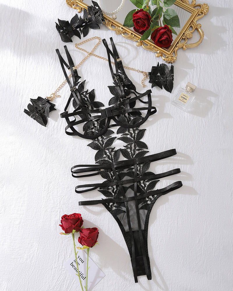 Black floral lace bodysuit set with choker, garter straps, and chain bracelet accessory