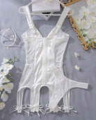 White satin mini dress with corset seams and ribbon bow hem, skirt cutouts