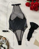 Black fishnet leather lingerie set with halter bodysuit, stockings, and chain accessories