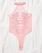 Pink sheer bodysuit with halter neck, floral lace panel, and thong back