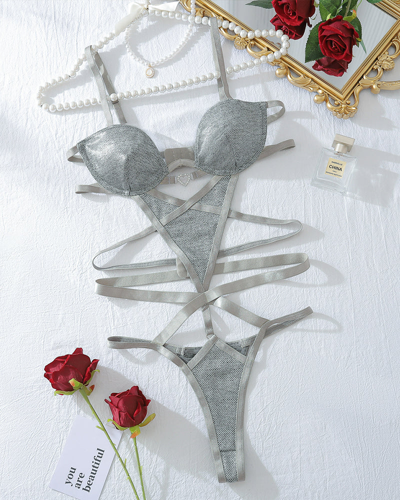 Silver sparkle strappy teddy bodysuit flat lay with underwire cups and cutout straps