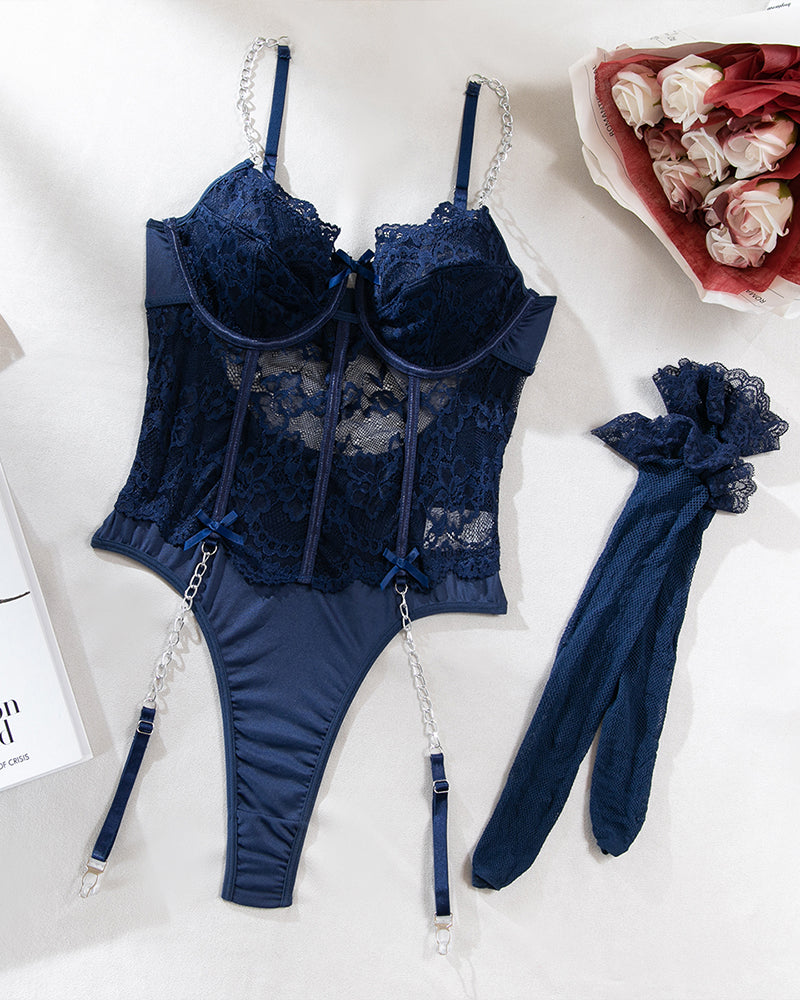 Navy lace bodysuit with fishnet stockings, chain garters, and matching garter accessory
