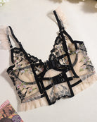 Lace-embroidered bra and panty set with black floral lace, adjustable straps and garters