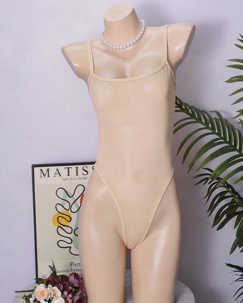 Cream sheer mesh high-cut bodysuit with thin straps and scalloped neckline.