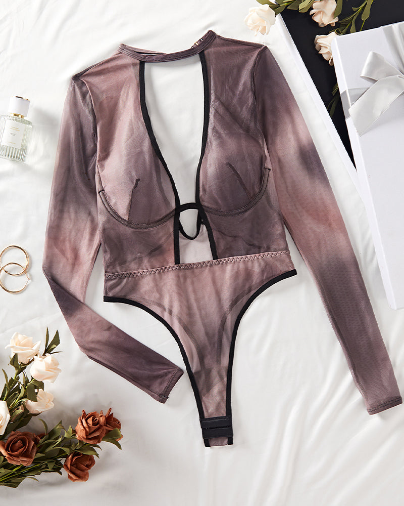Hollow mesh long sleeve bodysuit laid flat, dark tone with black plunge straps and thong cut