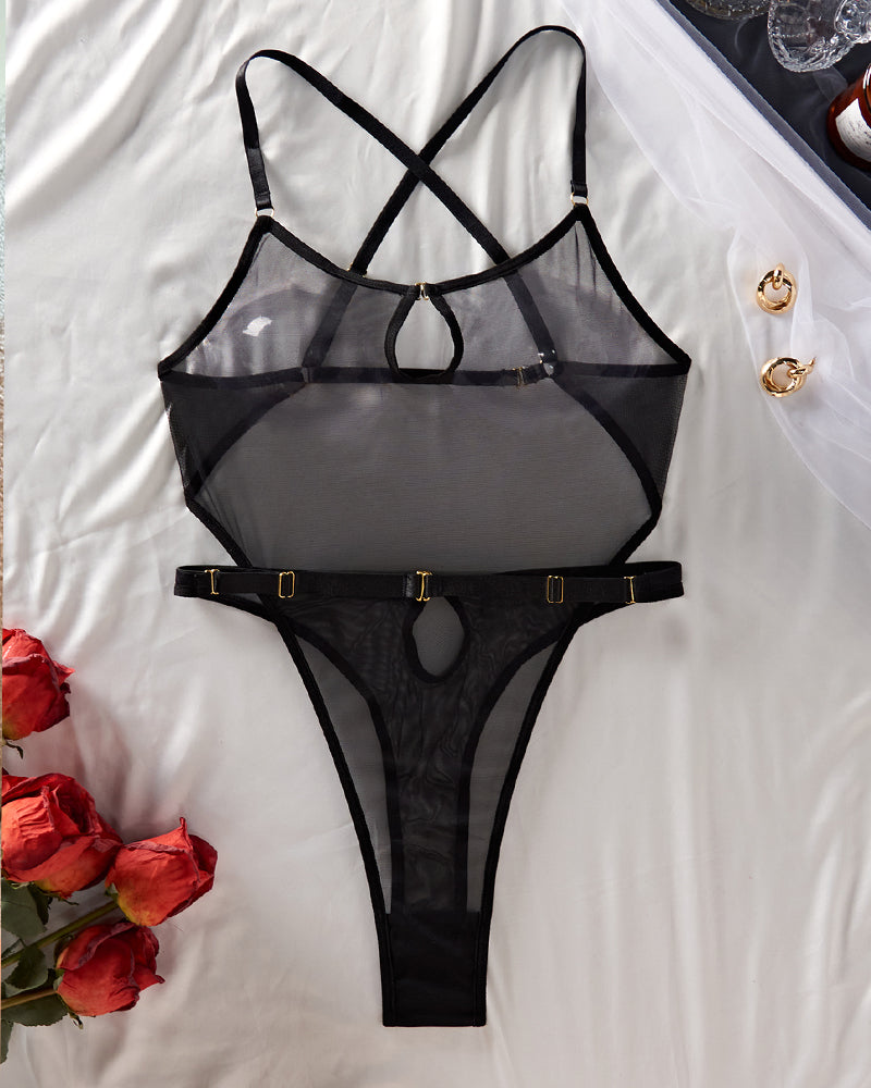 Black sheer mesh bodysuit with strappy X-back, ring detail, and high-cut bottom