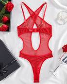 Red fishnet teddy with criss-cross straps, open back, and high-cut thong