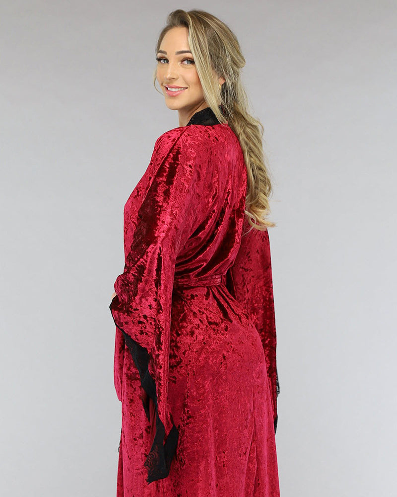 Red velvet belted robe with long sleeves and lace-trimmed hem