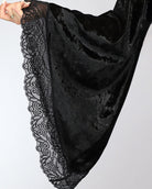 Black velvet robe with lace trim along hem and edge detail