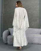 White velvet belted robe with lace trim, back view with tied waist