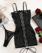 Black lace-up mesh slip dress with spaghetti straps and sheer cutout panels