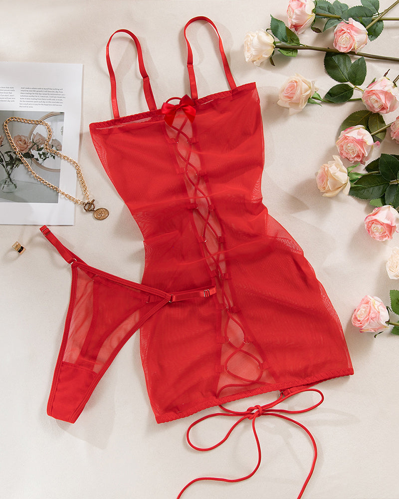 Backless lace-up slip dress in red with thin straps and sheer fabric panels
