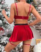 Red velvet lingerie set back view with adjustable bra straps, black belt and pleated mini skirt