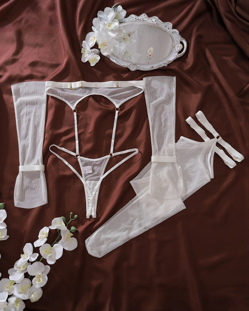 White lingerie set pieces: bodysuit, garter belt, stockings, gloves and thong, flat lay
