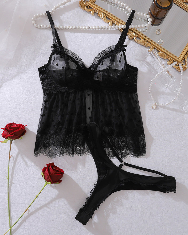 Black mesh tank top with matching thong panty, lace trim and tie straps