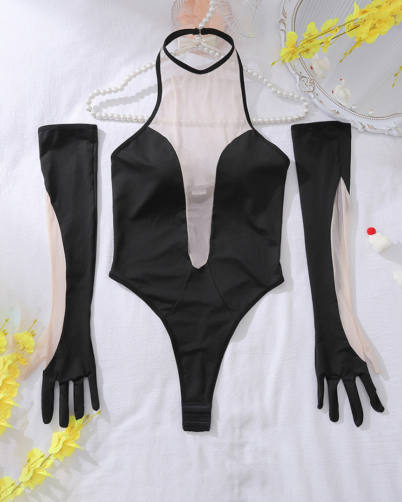 Black mesh panel bodysuit with matching gloves and sheer stockings, flat lay set