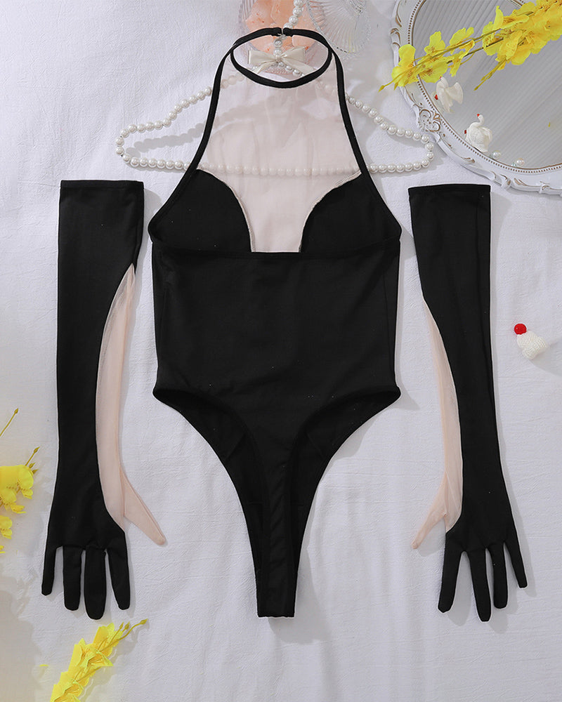 Black halter bodysuit set with long gloves and sheer stockings, laid out