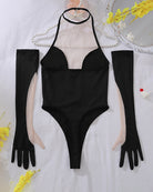 Black halter bodysuit set with long gloves and sheer stockings, laid out