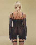 Black sheer mesh slip dress with thin shoulder straps and open back
