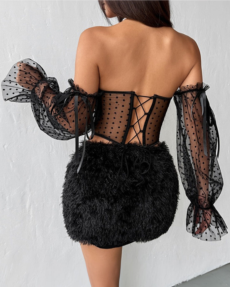 Back view: black off-shoulder polka-dot corset with corset lacing and sheer puff sleeves
