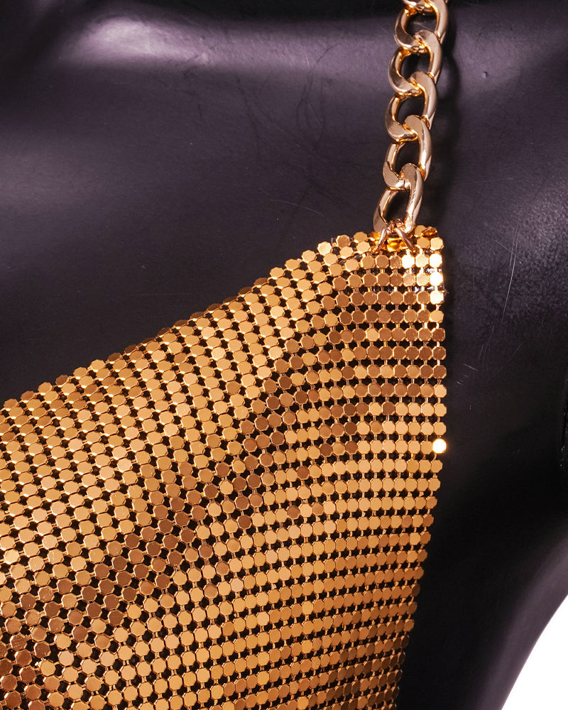 Gold sequin mesh fabric close-up with small round discs