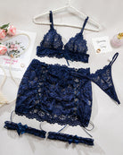 Navy lace bra and cutout mini skirt set with matching garters laid out flat
