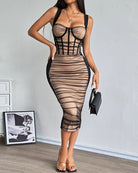 Black corset midi dress with sheer nude panels and ruched stripe detailing