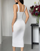 White midi dress with straight back straps and fitted ruched fabric