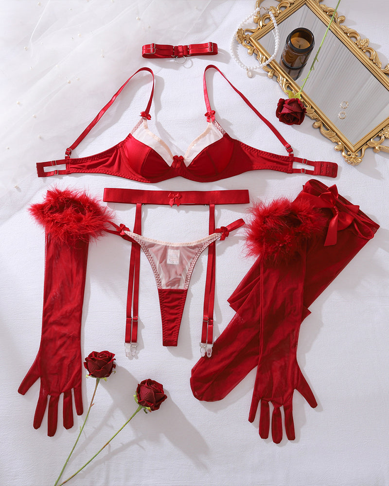 Wine red lingerie set flat lay: bra, garter thong, choker, fuzzy gloves, and stockings