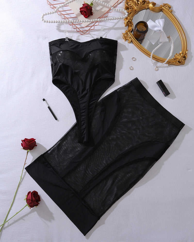 Black mesh sheer bodysuit and skirt set, bandeau top and long sheer skirt laid flat