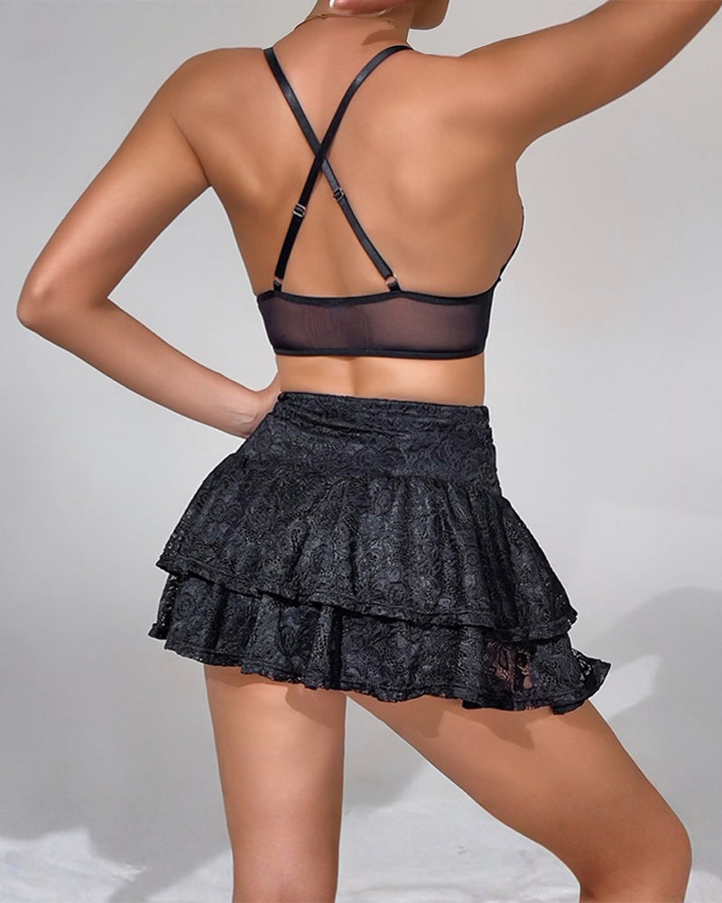 Black lace bralette with crisscross back straps and layered mini skirt set