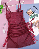 Wine red sheer mesh nightdress laid flat with lace cups and ruched skirt panel