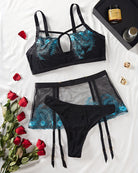 Black sheer bralette and panties set with turquoise feather embroidery and garter straps