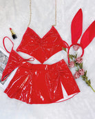 Red heart halter bra and flared mini skirt set with bunny ear headband, flat lay