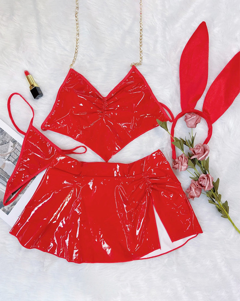 Red heart halter bra and flared mini skirt set with bunny ear headband, flat lay