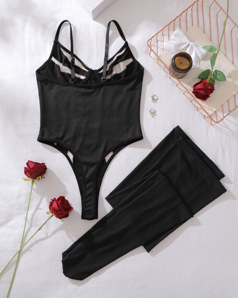 Black mesh bodysuit with thong cut and matching thigh-high stockings